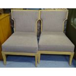 A pair of beech-framed and upholstered lounge chairs in the Art Deco manner, marked Rosello Paris to