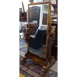 A Victorian mahogany-framed cheval mirror, on a serpentine-shaped base with paw feet, W80cm, H155cm