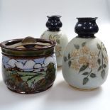 A Doulton tobacco jar with painted landscape, and a pair of vases, 15.5cm
