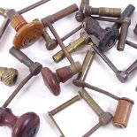 A collection of various clock keys, including examples with turned wood handles