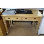 An Antique pine writing table, with 2 frieze drawers, on turned baluster legs, W108cm