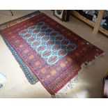 A red ground Tekke design rug, 195cm x 125cm