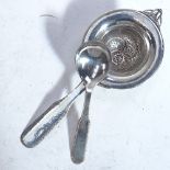 EVALD NIELSEN - an Art Nouveau Danish silver tea strainer and matching spoon, both pattern no. 25,