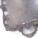 A large silver plated 2-handled serving tray, with allover engraved and embossed decoration, width