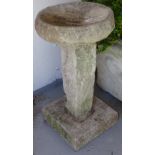 A 3-section concrete garden bird bath