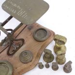 A set of brass postal scales, with dump weights