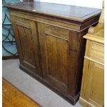 A Victorian oak filing cabinet, the 2 panelled doors opening to reveal a fitted interior, W105cm,