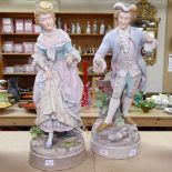 A pair of German porcelain figures on naturalistic plinths, height 39cm