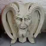 A composite mythical-headed wall plaque