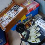 Various fishing equipment including flies, fly tying equipment, reference books, line etc