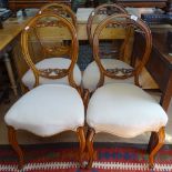 A set of 4 Victorian mahogany balloon-back dining chairs with upholstered seats