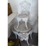 A white painted aluminium circular garden table, and 4 matching chairs