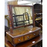 A Regency mahogany box swing toilet mirror, with 3 short drawers on bun feet, W52cm