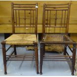 A pair of Arts and Crafts oak side chairs of stylised form, on turned legs