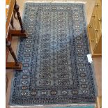 A green ground Tekke style rug, 158cm x 95cm