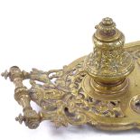 A heavy 19th century brass desk stand, with 2 removable inkwells, pen trays and central hinged
