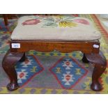 A small Victorian upholstered footstool, on cabriole legs, W50cm