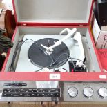 A Vintage HMV portable gramophone, built-in Garrard turntable with radio and mesh-guard speaker,
