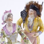 A pair of 19th century German porcelain figures, depicting street vendors, blue underglazed marks,