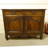 An 18th century oak dresser base, 2 frieze drawers and cupboards under, width 1.24m, height 96cm
