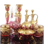 A collection of mainly 19th century gilded Bohemian ruby glassware, including a pair of