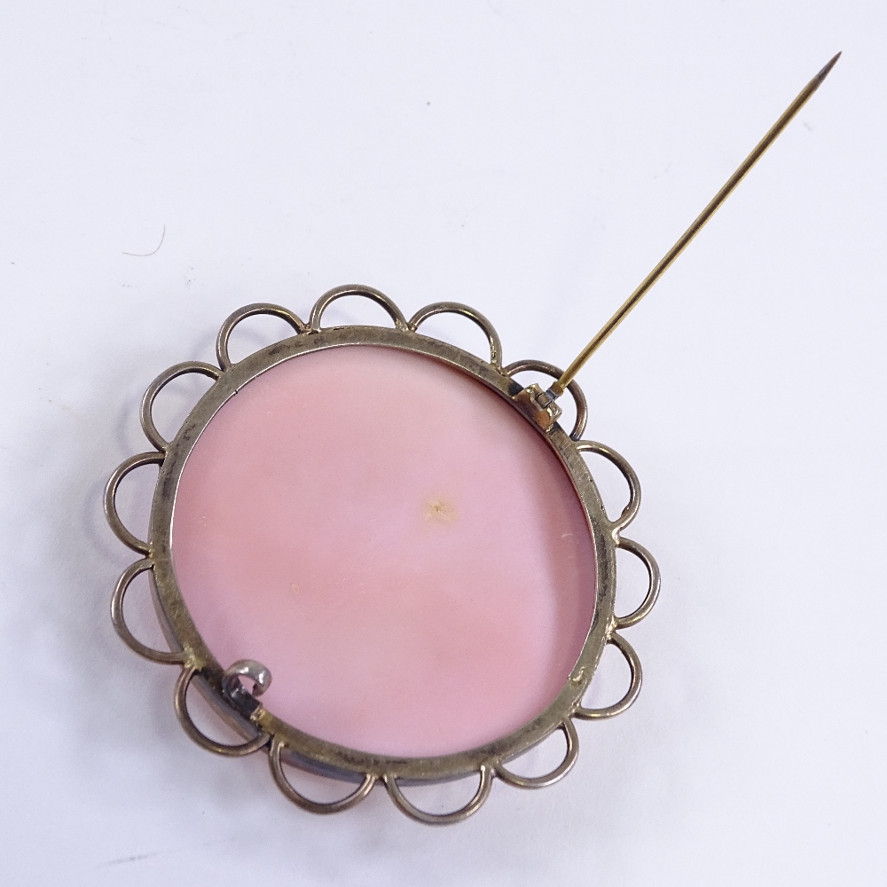 A Victorian relief carved pink cameo shell brooch, depicting Classical lady, in unmarked gilt- - Image 3 of 4
