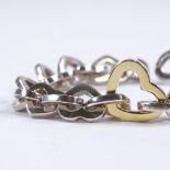 TIFFANY & CO - a sterling silver and 18ct gold multi-heart link bracelet, dated 2000, bracelet