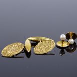An early 20th century pair of 9ct gold cufflinks, foliate and floral engraved decoration, and a pair