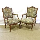 A pair of French 19th century carved oak-framed open armchairs