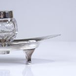 An Edwardian silver desk stand, marquees form with fitted cut glass silver topped ink well by Asprey