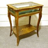 A late 19th century French kingwood and marquetry inlaid display table, with gilt-bronze mouldings