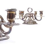 A pair of silver 4-branch squat candelabra, central carrying ring with scrolled branches and