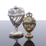 A Dutch unmarked white metal heart-shaped marriage box, and a smaller brass heart-shaped marriage