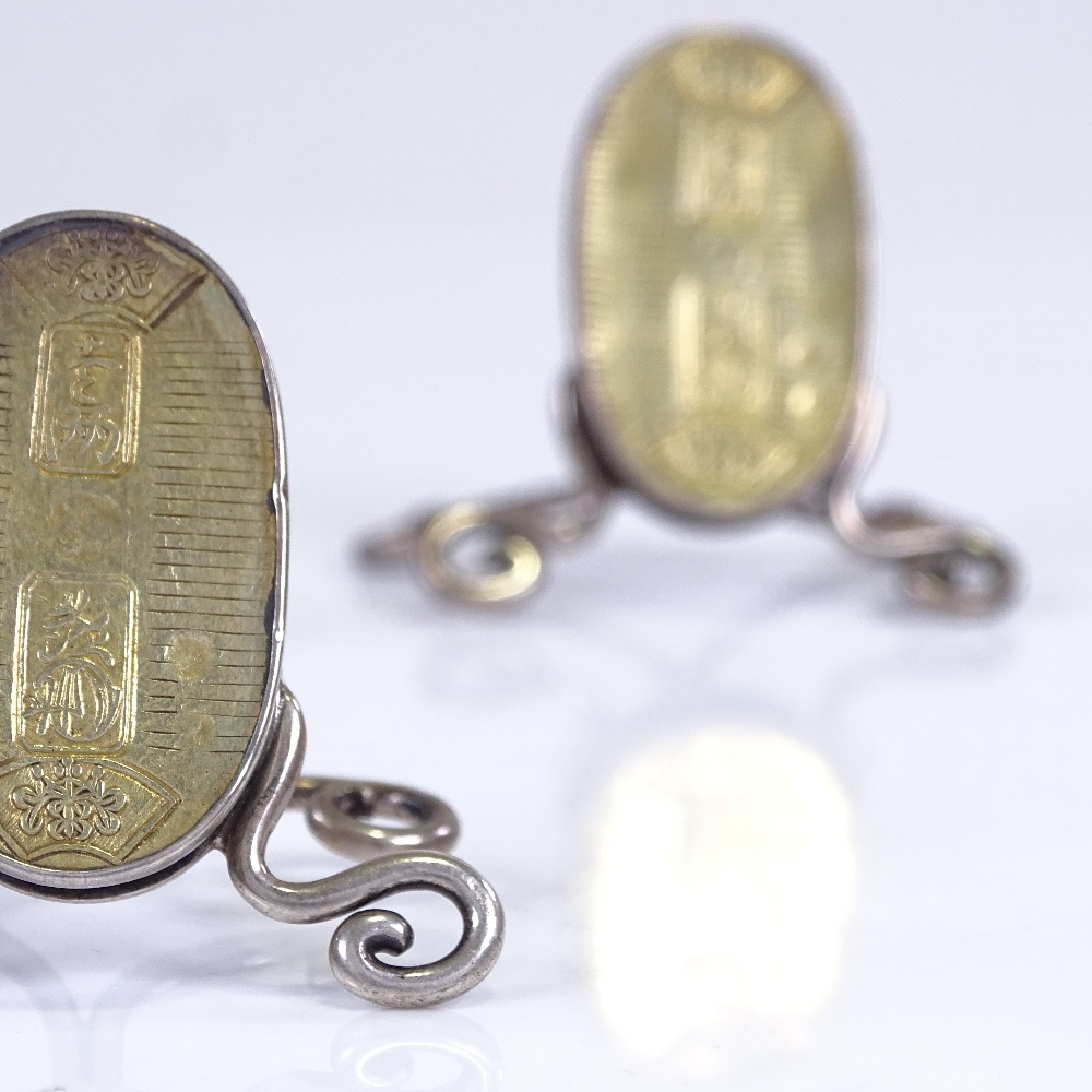 A pair of Victorian novelty silver Chinese ingot menu holders, by Alfred Fuller, hallmarks London