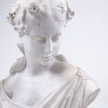 A finely carved Italian Carrara marble bust of a young woman wearing a hair garland, signed on