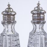 A matched pair of silver topped cut glass dressing table sifter bottles, by Henry Matthews,