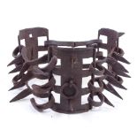 A Victorian iron spiked dog collar, 9.5cm across There is one spike missing from one of the