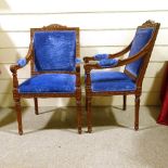 A pair of Continental carved and stained wood framed open-arm chairs, with blue velvet upholstery