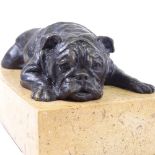 Bronze bulldog lying on granite plinth signed "Nick", length 18cm, height 7.5cm