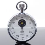 HEUER - a Vintage stainless steel Trackstar open-face top-wind stopwatch, white dial with Arabic