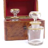 19th century French amboyna and tulip wood banded travelling perfume bottle case, containing 2