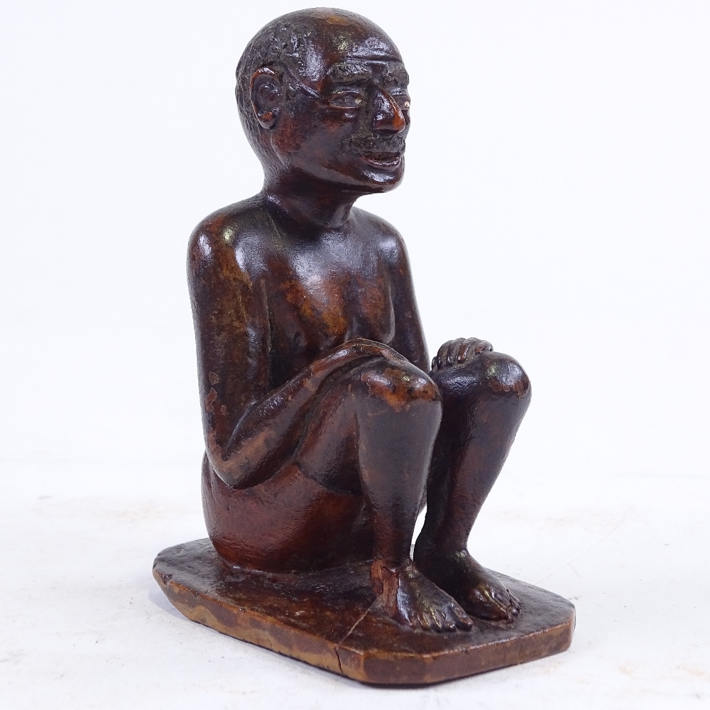An Indian 19th century wood carving of a seated man, height 9.5cm - Image 2 of 3