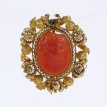 A Georgian relief carved coral cameo brooch, depicting female portrait, in unmarked yellow metal