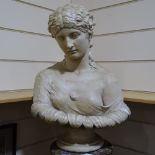 A hollow-cast plaster bust of a Classical woman, on fluted stained wood pedestal, overall height 1.