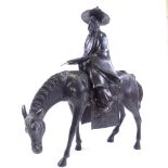 A patinated bronze Chinese sculpture in the form of a sage on horseback, height 42cm, probably mid-