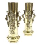 A pair of Chinese polished bronze sleeve vases, with relief decoration and cast handles, height