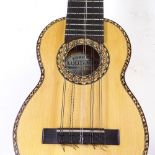 A South American Charango guitar, handmade, with instructions and music