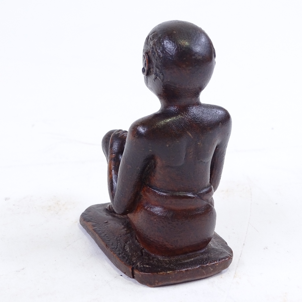 An Indian 19th century wood carving of a seated man, height 9.5cm - Image 3 of 3