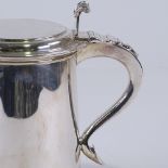 An 18th century style George V silver lidded tankard, tapered cylindrical form with reeded edge,