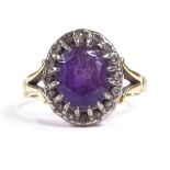An early 20th century 18ct gold amethyst and diamond cluster dress ring, setting height 14.2mm, size